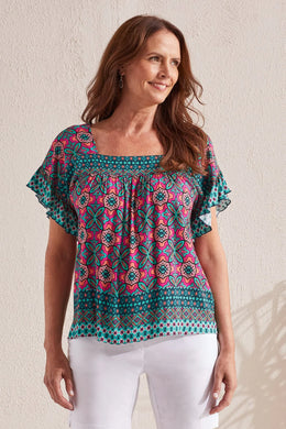 Bold colors make a bold look with this blouse featuring a face-framing square neckline and a lively print. Hollow-out pico stitching, stretch-infused crosshatch fabric, and a self-tie back might make this pick an all-time favorite.