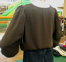 Load image into Gallery viewer, Brown blouse on a mannequin in a store setting.
