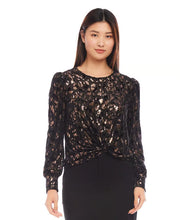 Load image into Gallery viewer, Discover our puff sleeve top, crafted from sumptuous velvet burnout knit and adorned with a chic cheetah print. The metallic foil detail infuses a hint of glamour, complemented by the contemporary twist front design. This top&#39;s elastic fabric ensures a blend of fashion and comfort.
