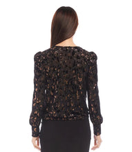 Load image into Gallery viewer, Discover our puff sleeve top, crafted from sumptuous velvet burnout knit and adorned with a chic cheetah print. The metallic foil detail infuses a hint of glamour, complemented by the contemporary twist front design. This top&#39;s elastic fabric ensures a blend of fashion and comfort.
