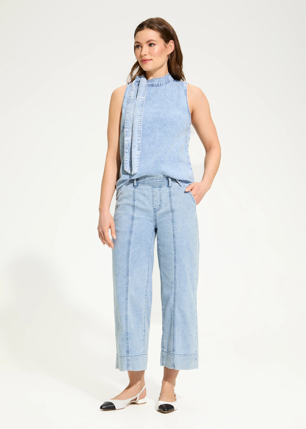 Designed for effortless elegance, these wide-leg crop trousers offer a relaxed yet polished look. The pull-on waistband ensures all-day comfort, while the soft pleats and faux-cuffed hems add a refined touch