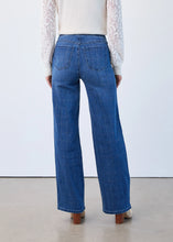 Load image into Gallery viewer, Model wearing blue and silver check wide legs jeans, white lace top and tan suede boots against a plain background.
