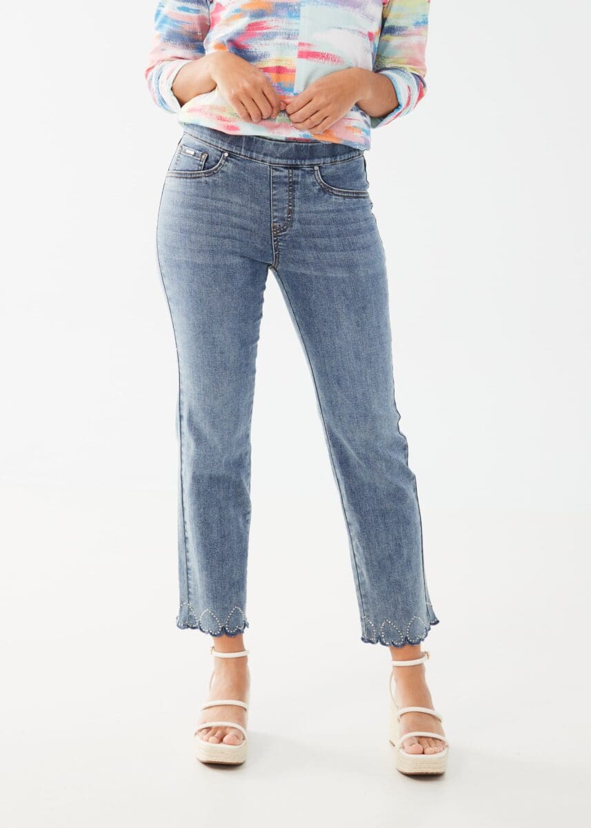 This pull-on straight ankle denim offers both comfort and style with its unique design. The bottom hems are adorned with playful upside-down hearts made of sparkling rhinestones. This fabulous jean is a fun and flirty addition to any wardrobe.  Color- Light blue. Mid-rise. Inseam 28