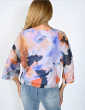 Load image into Gallery viewer, Flowy, light and easy, this gorgeous multi color print top is a must have for the warmer months.  A side tie and flowy sleeves create a style that can easily transition from day to evening.   Colors - Purple multi. Pullover. Side tie. Flowy design. Abstract print. Fabric -100% Polyester.
