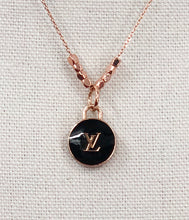 Load image into Gallery viewer, This delicate, yet bold, vintage Louis Vuitton Zipper Pull necklace in rose gold, gold and black is sure to become an essential piece in your collection. With its timeless style, it is perfect for everyday wear, adding a touch of elegance to any outfit.
