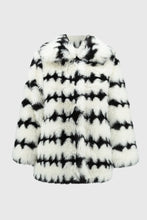 Load image into Gallery viewer, This stunning coat will surely make heads turn as you make an entrance. Combining luxurious faux fur with a striking black and white geometric pattern, this reversible coat adds a touch of chic French sophistication. It features practical pockets and a buttoned closure, seamlessly blending avant-garde fashion with timeless grace in a sleek and compact form.
