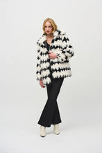 Load image into Gallery viewer, This stunning coat will surely make heads turn as you make an entrance. Combining luxurious faux fur with a striking black and white geometric pattern, this reversible coat adds a touch of chic French sophistication. It features practical pockets and a buttoned closure, seamlessly blending avant-garde fashion with timeless grace in a sleek and compact form.
