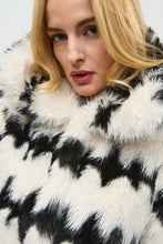 Load image into Gallery viewer, This stunning coat will surely make heads turn as you make an entrance. Combining luxurious faux fur with a striking black and white geometric pattern, this reversible coat adds a touch of chic French sophistication. It features practical pockets and a buttoned closure, seamlessly blending avant-garde fashion with timeless grace in a sleek and compact form.
