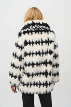 Load image into Gallery viewer, This stunning coat will surely make heads turn as you make an entrance. Combining luxurious faux fur with a striking black and white geometric pattern, this reversible coat adds a touch of chic French sophistication. It features practical pockets and a buttoned closure, seamlessly blending avant-garde fashion with timeless grace in a sleek and compact form.
