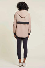 Load image into Gallery viewer, Prepare for the unpredictable weather of spring and summer with a versatile windbreaker and rain jacket. Stay warm and dry on cool, windy, and rainy days with this lightweight and reversible design. Choose between a chic tan color with black stripes or a bold black and orange animal print pattern. A must-have addition to any wardrobe.
