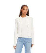 Load image into Gallery viewer, Woman wearing an off-white jacket over an off-white top and blue jeans against a white background.
