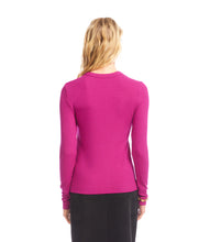 Load image into Gallery viewer, Woman wearing a magenta ribbed long sleeve top and black skirt against a white background.
