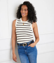 Load image into Gallery viewer, Woman wearing a brown and cream striped sleeveless top, blue jeans and belt against a white wall.
