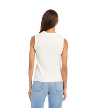Load image into Gallery viewer, Woman wearing an off-white sleeveless tank top and light blue jeans on a white background.
