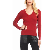 Load image into Gallery viewer, Woman wearing a V-neck sweater in tomato with black pants against a white background.
