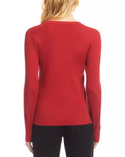 Load image into Gallery viewer, Woman wearing a V-neck sweater in tomato with black pants against a white background.

