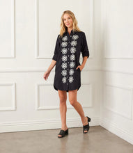 Load image into Gallery viewer, Elevate your wardrobe with the Roll Tab Embroidered Shirtdress by Karen Kane—a perfect blend of classic elegance and artisanal charm. Featuring delicate floral silk embroidery, a collared neckline, and adjustable roll-tab sleeves, this laid-back yet polished dress is designed for effortless style.
