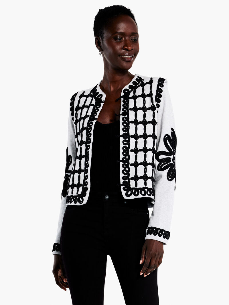 This contemporary jacket infuses classic styles with a modern black and white motif. A delicate soutache ribbon trim ensures intricate textural patterns, while flower detail at the sleeves offers a unique, feminine touch. Durable knot and loop closures are seamlessly integrated in the trim, while a round neck and flange detail at the armhole provide a refined look. Midweight and striking, this piece is sure to make an impression.