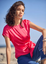 Load image into Gallery viewer, Turn heads with the Rosalia Tie Drape Mix Media Top by Lysse—a stunning fusion of elegance and modern flair. Designed in a Pink Martini hue, this top features a graceful draped silhouette and a chic front side tie, effortlessly blending sophistication with a touch of playful charm. Crafted from premium mix-media fabric, it offers a luxurious feel and a flattering fit, making it perfect for both day-to-night styling. Whether paired with tailored trousers or sleek denim, this piece is a must-have.
