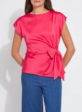 Load image into Gallery viewer, urn heads with the Rosalia Tie Drape Mix Media Top by Lysse—a stunning fusion of elegance and modern flair. Designed in a Pink Martini hue, this top features a graceful draped silhouette and a chic front side tie, effortlessly blending sophistication with a touch of playful charm. Crafted from premium mix-media fabric, it offers a luxurious feel and a flattering fit, making it perfect for both day-to-night styling. Whether paired with tailored trousers or sleek denim, this piece is a must-have.

