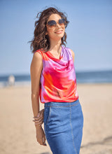 Load image into Gallery viewer, Elevate your wardrobe with the Rosario Draped Printed Top by Lysse, a captivating blend of elegance and effortless charm. Adorned with a floating floral print in a stunning color combination, this piece flows with a graceful drape that flatters every movement. Crafted for both comfort and sophistication, its soft, luxurious fabric and chic silhouette make it a versatile staple—perfect for day-to-night styling. Whether paired with tailored trousers or sleek denim, this top is designed to turn heads.
