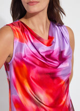 Load image into Gallery viewer, Elevate your wardrobe with the Rosario Draped Printed Top by Lysse, a captivating blend of elegance and effortless charm. Adorned with a floating floral print in a stunning color combination, this piece flows with a graceful drape that flatters every movement. Crafted for both comfort and sophistication, its soft, luxurious fabric and chic silhouette make it a versatile staple—perfect for day-to-night styling. Whether paired with tailored trousers or sleek denim, this top is designed to turn heads.

