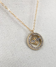 Load image into Gallery viewer, The Rosemary necklace is a stunning piece, featuring a vintage designer button adorned with sparkling rhinestones. Its delicate gold chain adds an extra touch of brilliance. Whether worn alone or layered with other necklaces, this modern piece adds the perfect amount of shine to any outfit, from a simple tee and jeans to a more dressed-up look.
