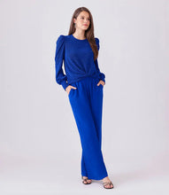 Load image into Gallery viewer, These wide leg pants effortlessly blend style with comfort, thanks to the elasticized waistband providing a flattering and comfortable fit. It&#39;s the ideal fusion of fashion and functionality.  Color - Royal blue. Full length. Wide-leg. Elasticized waistband. Inseam: 30 inches (size M). Front rise: 13 1/8 inches (size M). Leg Opening: 25 inches (size M). Fabric -Moss Crepe: 100% Polyester.
