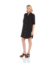 Load image into Gallery viewer, Woman wearing a black button-up shirt dress and sandals against a white background.
