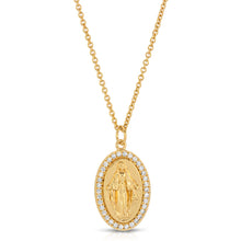 Load image into Gallery viewer, Featuring an oval silhouette pendant, the Saint Mary Necklace highlights Virgin Mary in the center of the drop pendant and is surrounded by cubic zirconia. Perfect to wear as a statement piece or as a layering piece. Color- Gold and clear. Cubic zirconia. 14K Gold plating over brass. 16&quot; chain length + 2&quot; extender. 17mm pendant.
