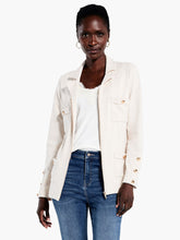 Load image into Gallery viewer, A fashionable twist on traditional blazer styling, this Nic and Zoe piece is an easy-to-wear wardrobe staple. A zip closure and four panel welt pockets complete the contemporary silhouette, which sits at the hip. A pair of cuff buttons lend a nod to classic style.  Color- Sandshell. Regular fit. Shirt collar Zip closure.

