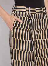 Load image into Gallery viewer, Refined and effortlessly chic, the Santana Pleated Trouser by Lysse is a modern wardrobe essential designed for the woman who values both comfort and sophistication. Crafted from breathable Stretch Woven fabric with 2X stretch, these trousers feature a flattering wide-leg silhouette, deep front pleats, and a concealed tricot front panel that smooths and shapes. The elasticized back waistband ensures a flexible fit, while functional side pockets with mesh facing reduce bulk without sacrificing practicality.
