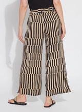 Load image into Gallery viewer, Refined and effortlessly chic, the Santana Pleated Trouser by Lysse is a modern wardrobe essential designed for the woman who values both comfort and sophistication. Crafted from breathable Stretch Woven fabric with 2X stretch, these trousers feature a flattering wide-leg silhouette, deep front pleats, and a concealed tricot front panel that smooths and shapes. The elasticized back waistband ensures a flexible fit, while functional side pockets with mesh facing reduce bulk without sacrificing practicality.
