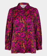 Load image into Gallery viewer, This elegant blouse is crafted from a luxuriously soft satin and features a button-up design with a shirt collar, and delicate pleating on its long-cuffed sleeves. Its versatility allows it to be worn for work and leisure alike.  Color - Magenta, pink and coral. Floral print. Button down. Shirt collar. Subtle pleat detailing on sleeves. Long cuffed sleeves.
