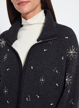 Load image into Gallery viewer, Model wearing a charcoal grey jacket with rhinestone snowflake patterns and white turtleneck against a white background.
