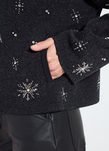 Load image into Gallery viewer, Close-up of charcoal grey with snowflake embellishments on a white background.
