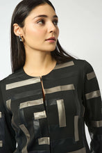 Load image into Gallery viewer, Woman wearing a black multi patterned jacket against a white background.
