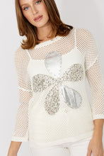 Load image into Gallery viewer, Woman wearing a white mesh top with a decorative silver sequin flower and white pants on a plain background.
