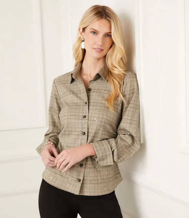 This sequin side-pleat shirt by Karen Kane, style 4L19101, is expertly crafted from premium woven material for a flattering and fitted silhouette. The addition of embroidered sequin adds a refined touch of elegance and shimmer, making it an ideal choice for any occasion. Featuring shank buttons, this shirt exudes a sophisticated and polished look.