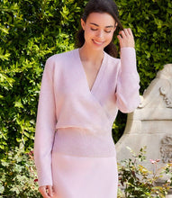 Load image into Gallery viewer, Woman wearing a light pink sweater and light pink skirt against a white background.

