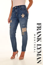 Load image into Gallery viewer, A versatile wardrobe essential, the Frank Lyman Denim 234146U boasts a sophisticated design with sequin patches, stars and cheetah patches. This classic denim silhouette is a must-have for any fashionista, providing the perfect blend of style and comfort for any occasion. Offering a fun, flirty look, the Frank Lyman Denim is sure to be a staple in any closet.  Color- Blue and silver. Five pockets. Zip and button closure. Front Patch Details. Silver sequins. Cheetah patches.
