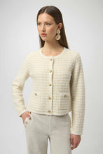 Load image into Gallery viewer, Woman wearing a winter white and gold sequined textured cardigan with gold buttons, winter white pants with gold buttons and gold statement earrings against a white background.
