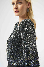 Load image into Gallery viewer, Close-up of model wearing a black and silver sequined jacket and silver earrings against a white background.
