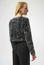 Load image into Gallery viewer, Woman wearing a black and silver sequined long sleeve jacket and black pants against a white background.

