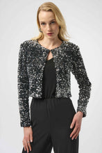 Load image into Gallery viewer, Woman wearing a black and silver sequined long sleeve jacket over a black top and black pants against a white background.
