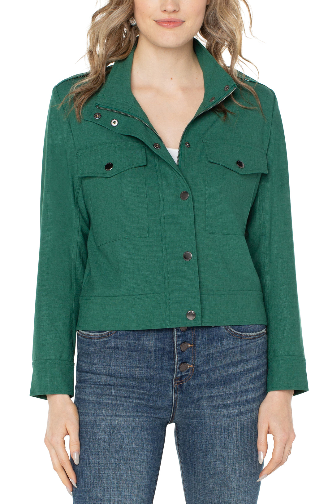 Liverpool Los Angeles' Utility Crop Jacket offers minimalism with on-trend appeal. Crafted from a soft and stretchy twill fabric, this piece provides an optimal blend of feminine charm and edgy appeal for versatile styling.  Color - Serpentine; Bright green. Collared. Double front patch pockets. Button and zip front closure. Snap closure at wrists. Cropped style. Fabric - 47% Polyester. 44%Viscose. 6%Elastane. 3% Other Fiber.