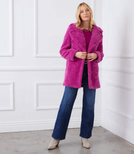 Load image into Gallery viewer, Woman wearing a bright orchid coat over an orchid color top, blue jeans with black belt and tan suede boots against a white background.
