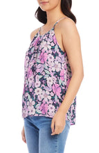 Load image into Gallery viewer, The Karen Kane Shay Shirred Floral Tank is a vibrant, sleeveless top featuring soft shirring and sleek cutaway shoulders for a flattering fit. Designed with a bold floral print in berry, purple, navy, and multicolor hues, this tank adds a fresh, feminine touch to any outfit. Crafted from lightweight, breathable fabric, it’s perfect for layering or wearing solo in warm weather.
