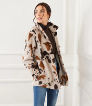 Load image into Gallery viewer, A stylish choice for crisp days, this relaxed-fit shirt jacket showcases a striking allover print, perfect for easygoing layering. Pairs beautifully with denim, faux leather pants or a brown or black trouser. Color- Shades of brown. Appaloosa print. Collared button down. Long sleeve. Side functional pockets.
