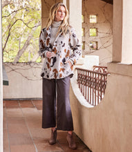 Load image into Gallery viewer, A stylish choice for crisp days, this relaxed-fit shirt jacket showcases a striking allover print, perfect for easygoing layering. Pairs beautifully with denim, faux leather pants or a brown or black trouser. Color- Shades of brown. Appaloosa print. Collared button down. Long sleeve. Side functional pockets.
